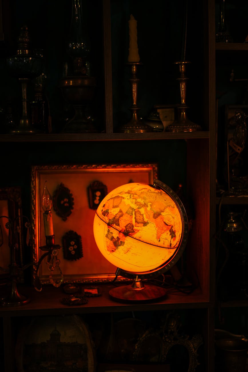 illuminated globe on table in dark