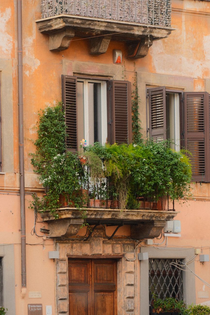 charming rustic balcony with lush greenery
