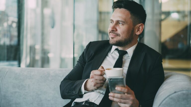 businessman enjoying coffee break in modern office